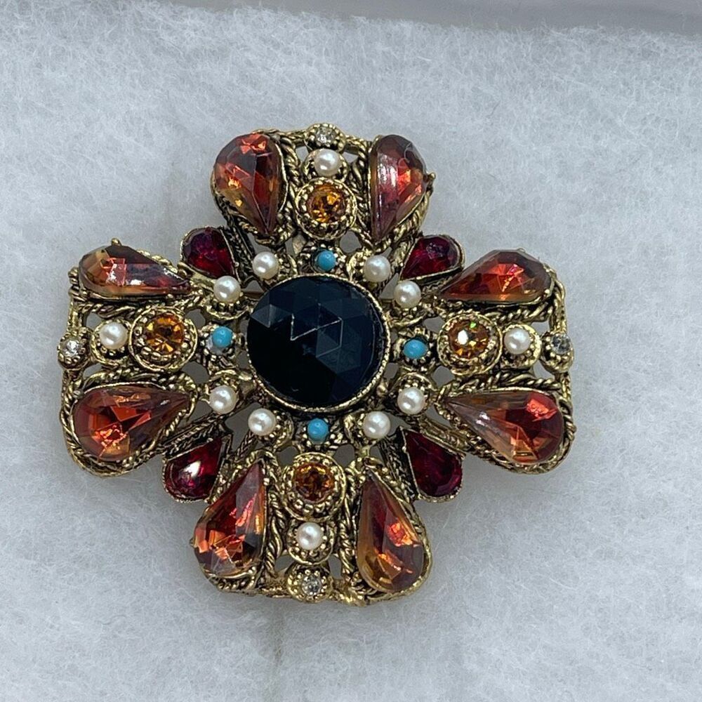 Vintage Maltese cross brooch red & Amber colored faceted glass .